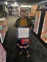 Load image into Gallery viewer, Photo of artist Rhoda Tjitayi presenting her Piltati Tjukurpa painting at Art by Farquhar Aboriginal Art Gallery.
