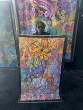 Load image into Gallery viewer, The artist Rhoda Tjitayi photographed beside her vibrant Piltati Tjukurpa painting at Art by Farquhar Aboriginal Art Gallery.
