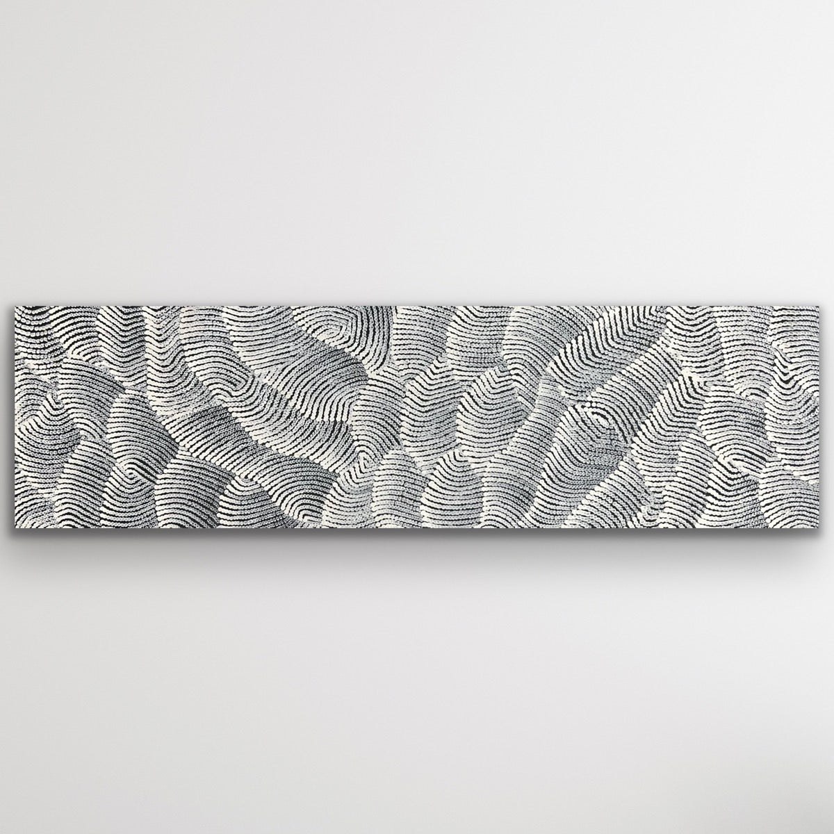 Wide artwork showing soft grey and white dot patterns inspired by desert dunes and windswept textures.