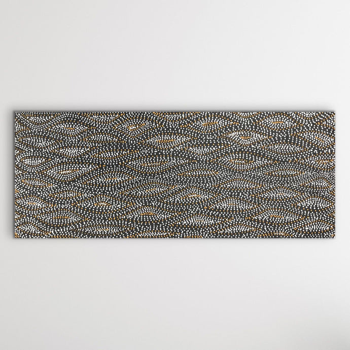 Indigenous Seed Dreaming artwork by Marshall Jangala Robertson, 90cm x 36cm, shown horizontally with detailed flowing dot work against a white wall.