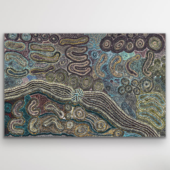 Layers of desert blue, green and ochre ripple across Teresa Pimangka’s Seven Sisters, symbolising the movement of the ancestral story through sky and land.