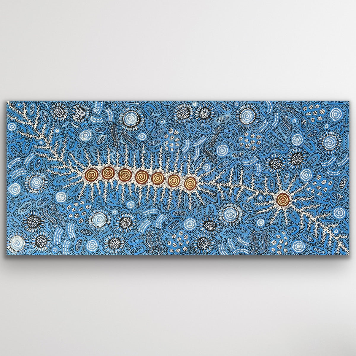 Full view of Michelle Possum Nungurrayi’s Seven Sisters and Women Dancing Ceremony painting showing intricate blue dot work.