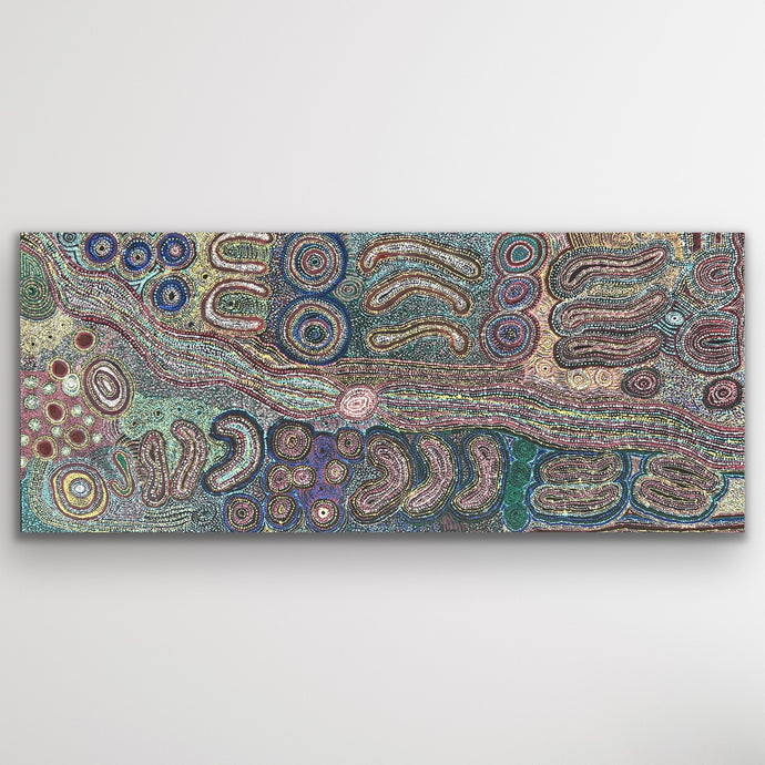 A panoramic artwork alive with soft greens and mauves, depicting ancestral journeys through flowing patterns.