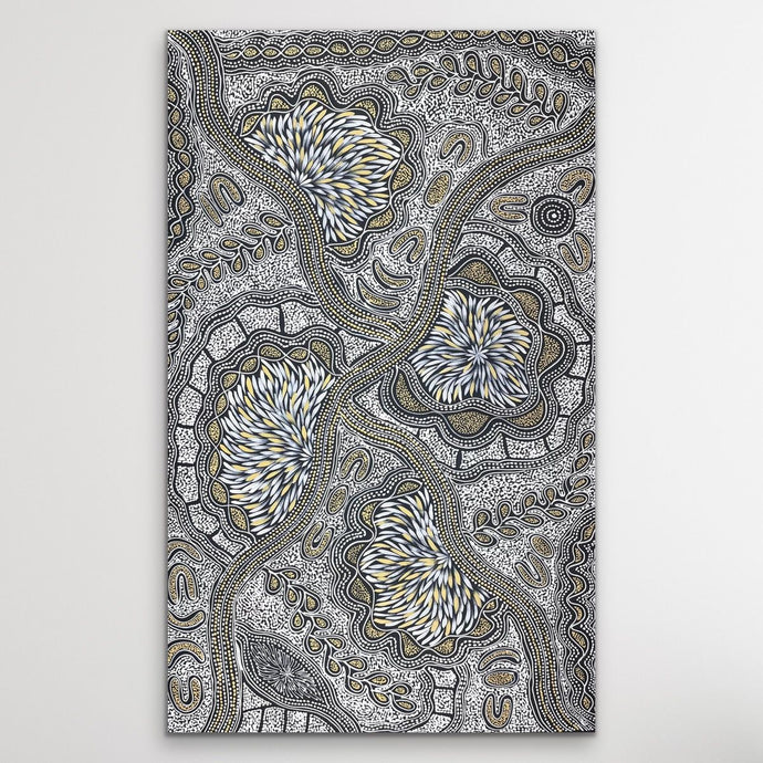 Black, white and cream Aboriginal artwork by Sharon Numina on white wall vertical.