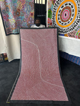 Load image into Gallery viewer, Artist Tansy Martin holding her Bush Onion Aboriginal artwork on canvas
