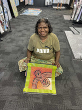 Load image into Gallery viewer, Photo of Teresa Baker presenting her Minyma Maililu painting inside Art by Farquhar Aboriginal Art Gallery, Edwardstown.
