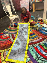 Load image into Gallery viewer, The artist Teresa Baker photographed beside her long blue painting Minyma Mailiu at Art by Farquhar Aboriginal Art Gallery.
