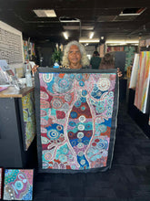 Load image into Gallery viewer, Teresa Punami Mula Pimangka holding her painting 'Seven Sisters' 118cm x 81cm
