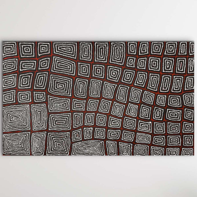 A canvas painting featuring a  black and brown colors, original indigenous artwork.