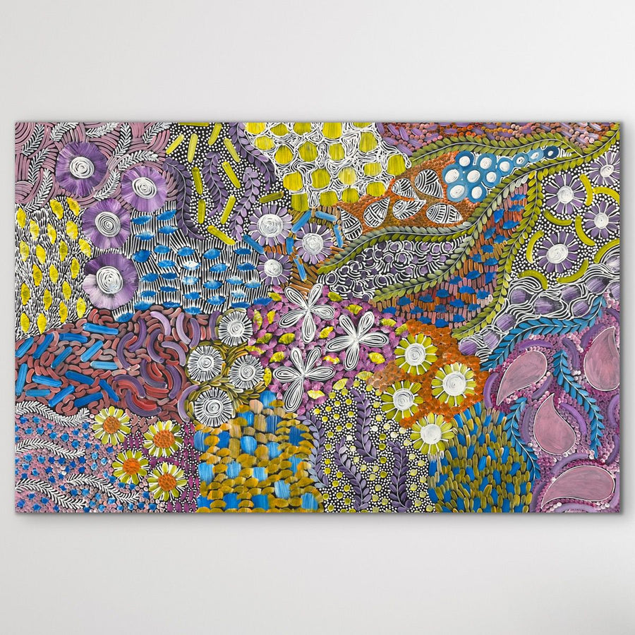 Coloruful Aboriginal artwork with floral patterns on a white background