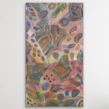 Load image into Gallery viewer, "Yam Dreaming" Jedda Purvis Kngwarreye 152cm x 86cm dot painting pattern with abstract leaf-like and circular motifs in pink, blue, yellow, green, brown, and orange tones, shown against a light gray background.

