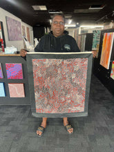 Load image into Gallery viewer, Chantelle robertson holding her painting 
