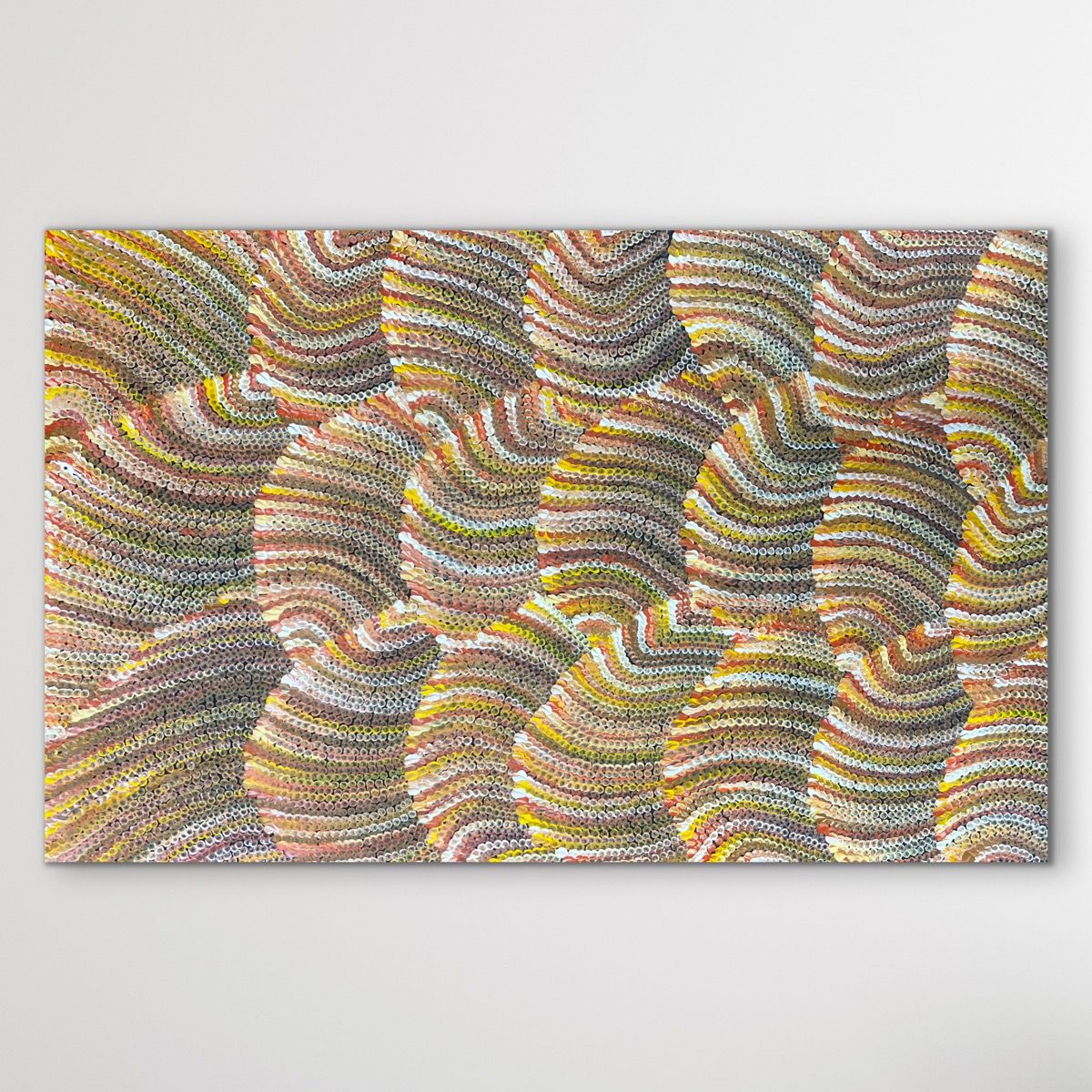 sand dunes painting brown, red, yellow earthy colours displayed on white wall