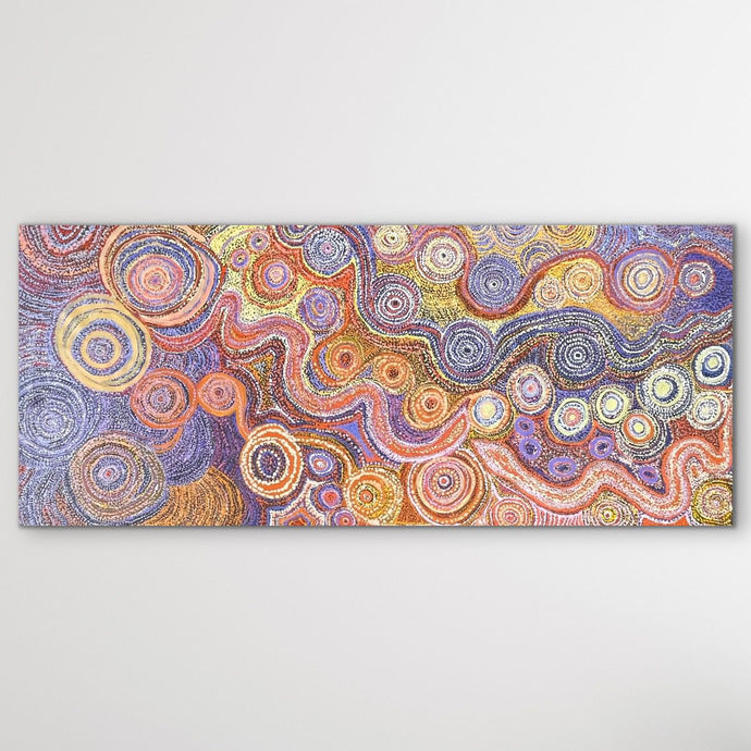 Piltati Tjukurpa Aboriginal art by Rhoda Tjitayi authentic Indigenous painting from Australia shown horizontal on white wall